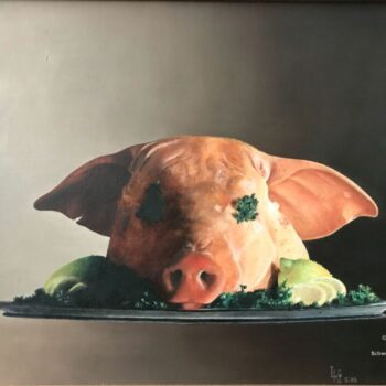 Schweinekopf mit Zitronen